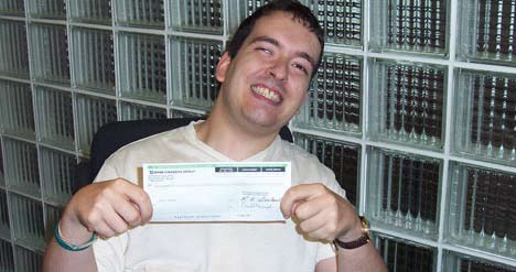 boy holding a cheque