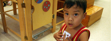 photo of child holding visual symbol/token